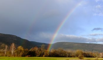 Rainbow over green fields
